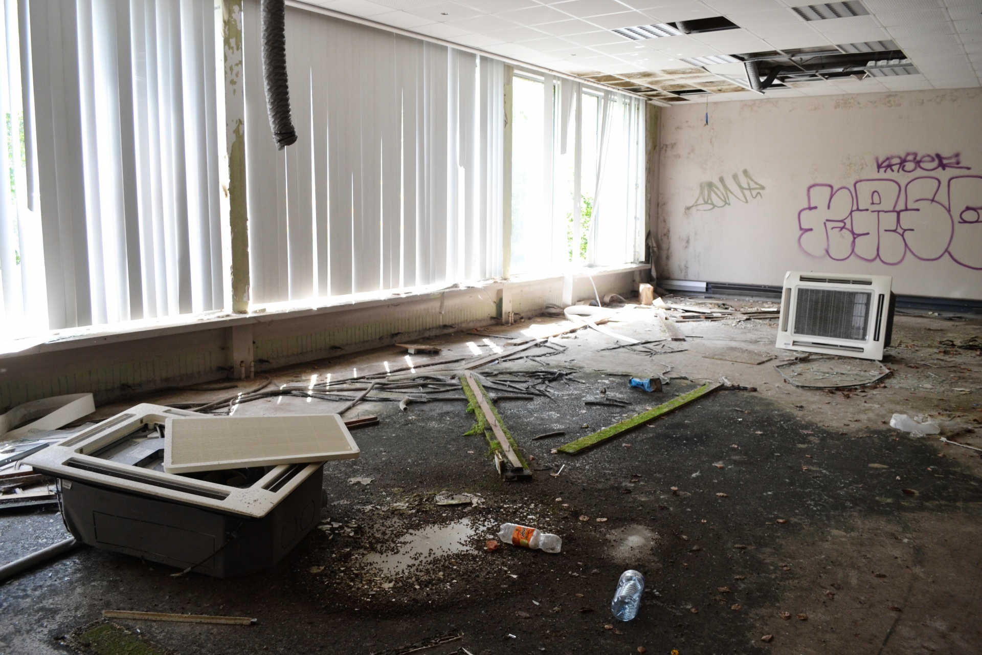 Abandoned hall with white window blinds