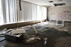 Abandoned hall with white window blinds
