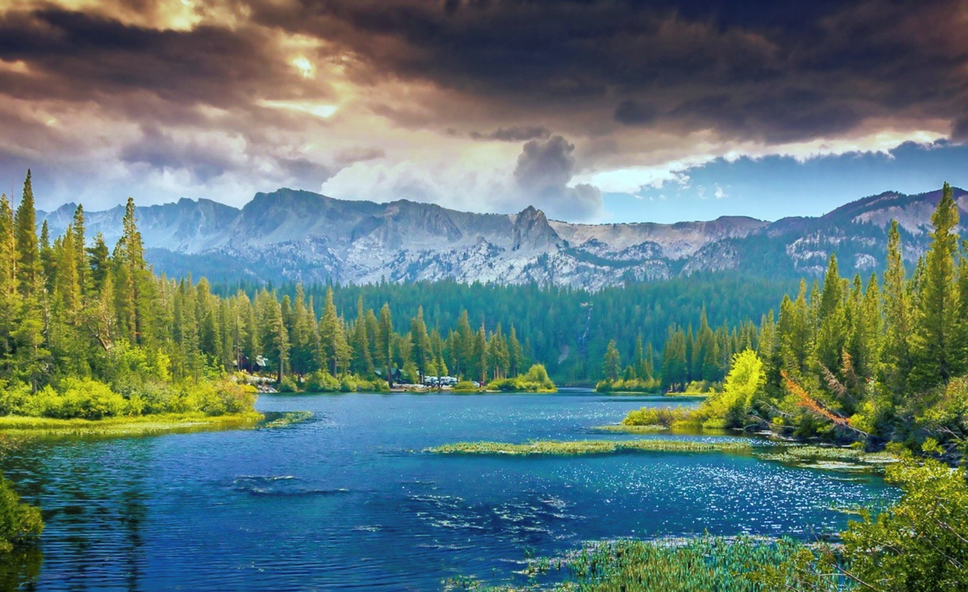 Scenic View Of Lake and Mountain Backdrop
