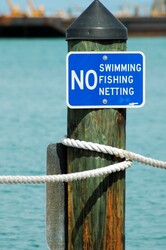 No fishing, swimming, netting sign