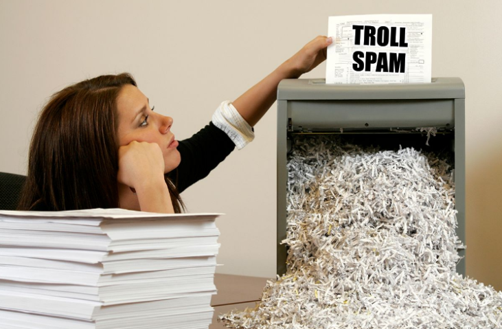 A bored shredder paper woman: troll spam