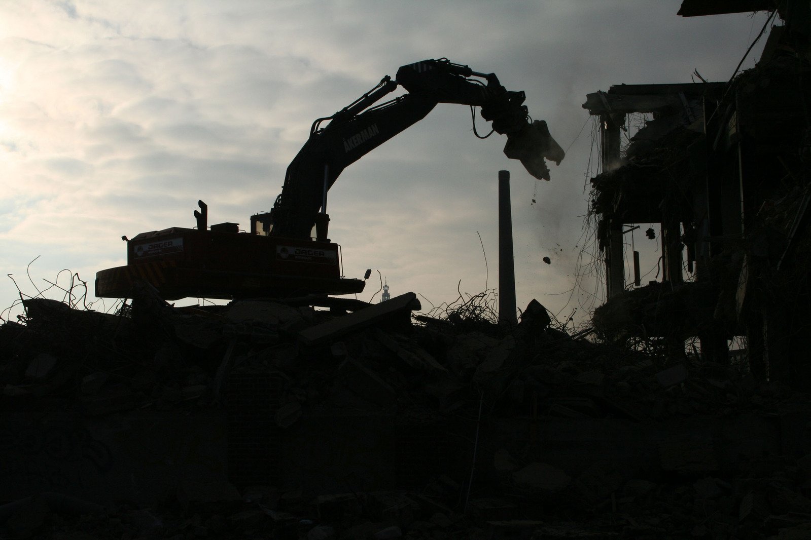 Demolishing crane eating the building