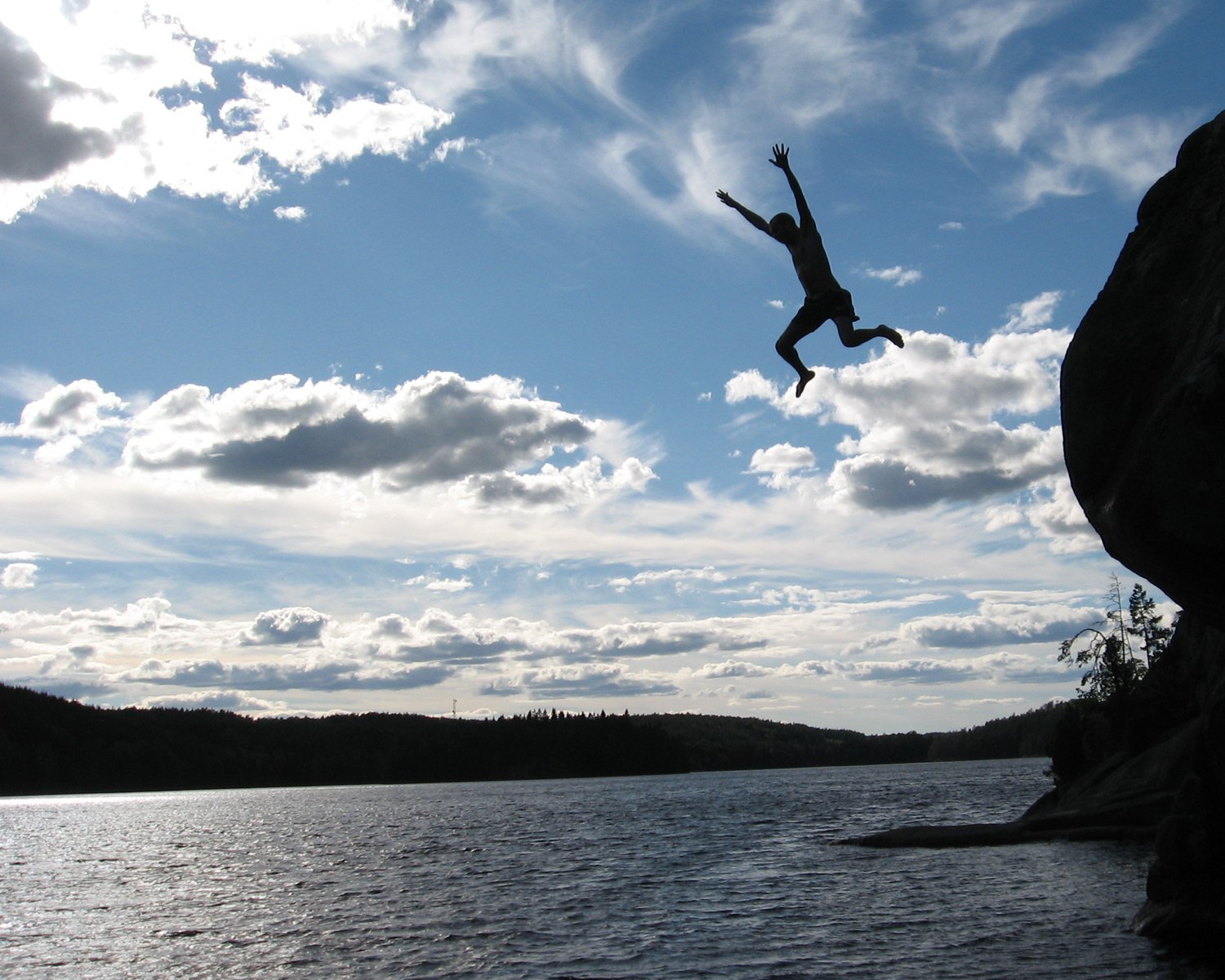 Man jumping in lake