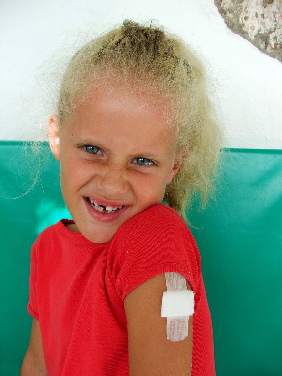 Girl with plaster & missing tooth