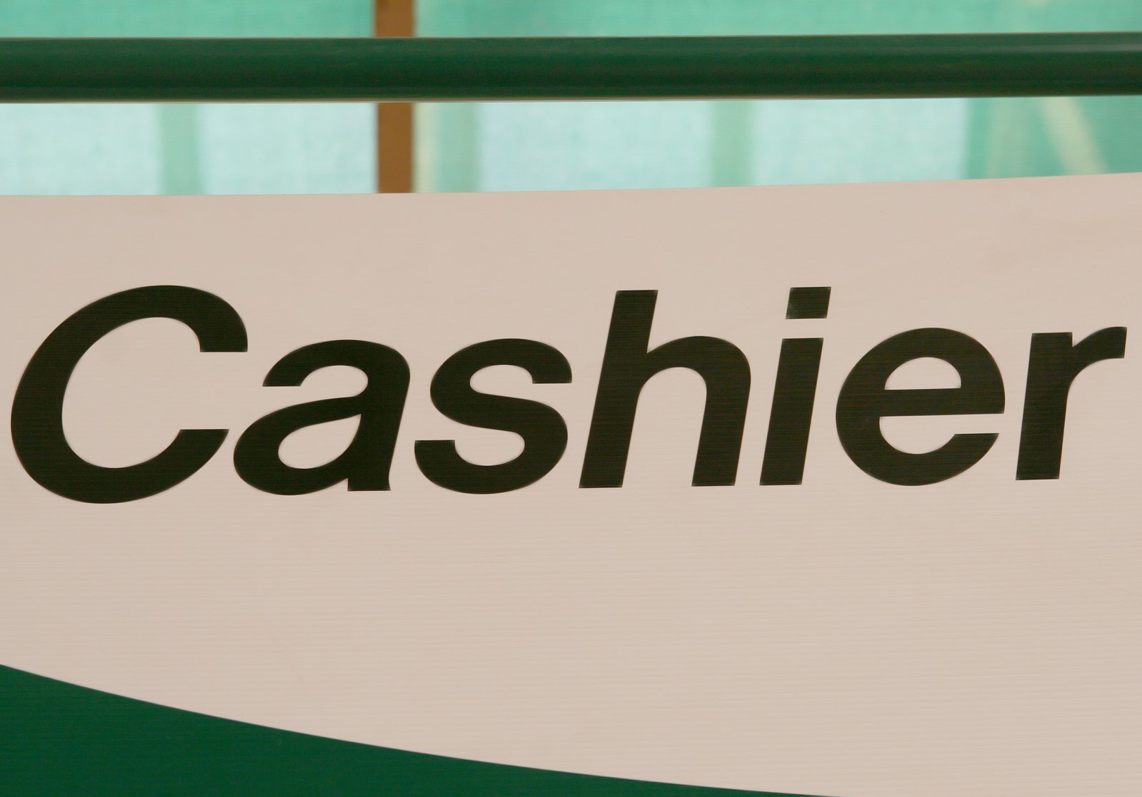 Cashier sign indoors, indicating location to pay