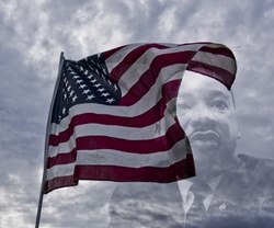 Martin Luther King behind an American Flag