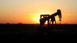 An oil rig silhouetted at sunset in the Oklahoma Panhandle