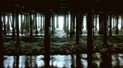 Walkway beneath the famous Santa Monica Pier holds a mysterious beauty all its own.