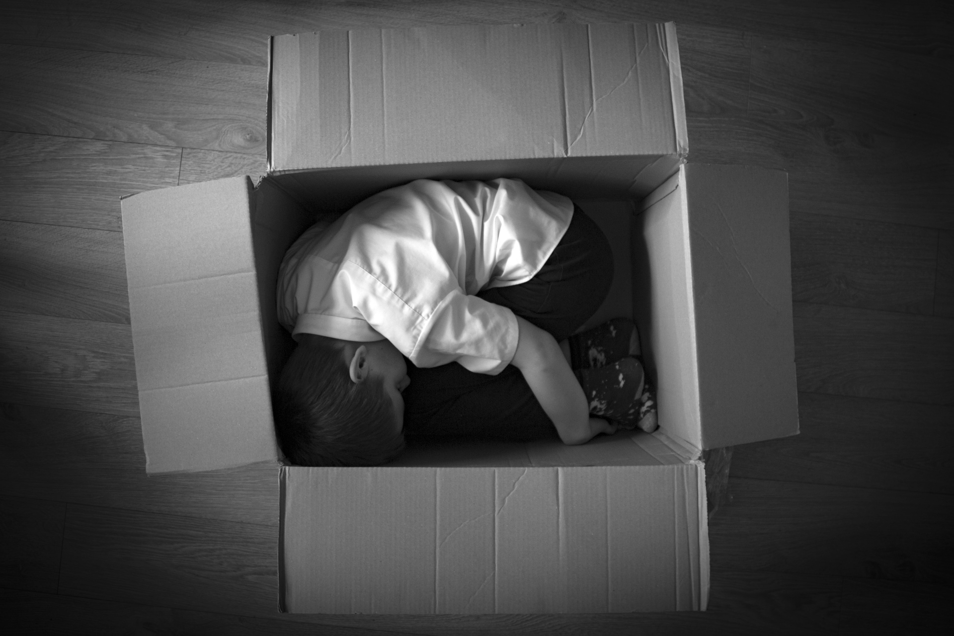 Boy In Cardboard Box