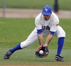 Baseball Player Fielding a Ball