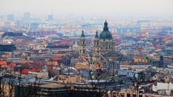 A view of St Stephens basilica and ferris wheel in Budapest, Hungary