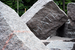 A boulder engraved with the word hate