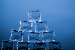 Ice Cubes isolated on the blue background