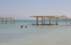 Swimmers in Dead Sea with hats