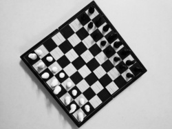 Black and white chessboard shown from the top