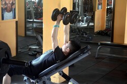 A man working out with free weights