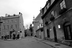 Black and white photo of a sidewalk in old Quebec city Canada