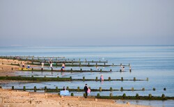 People enjoying the beach on a summer day