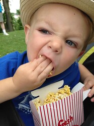 Toddler eating Popcorn