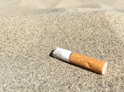 A cigarette butt left on the beach