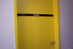 The door that opens into the morgue storage at the hospital