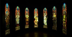 Angels in a semicircle of stained glass windows