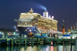Night view of a cruise ship docked in port
