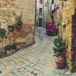 Old stone street in the town in Italy