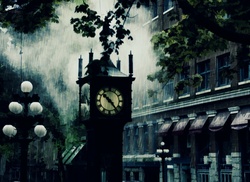 Overcast rainy day surrounds the antique historic steam clock in Vancouver, Canada
