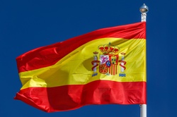 Spanish flag against blue sky