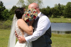 Wedding Couple Hiding Kiss