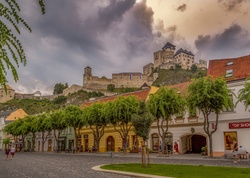 View of the old center and the castle, with locals and visitors, in Trencin, Slovakia