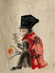 Monkey wearing human clothes with fan