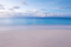 Beach with blurred waves and sky in the morning
