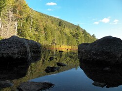 Photo of bubble pond with large rocks