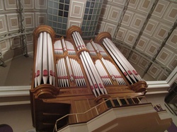 A photo taken of a pipe organ in the Veremark Hall in Port Elizabeth from below.