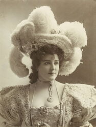 American actress and singer Lillian Russell wearing a hat with plumes