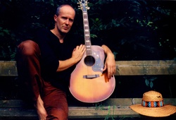 Man With Guitar And Straw Hat