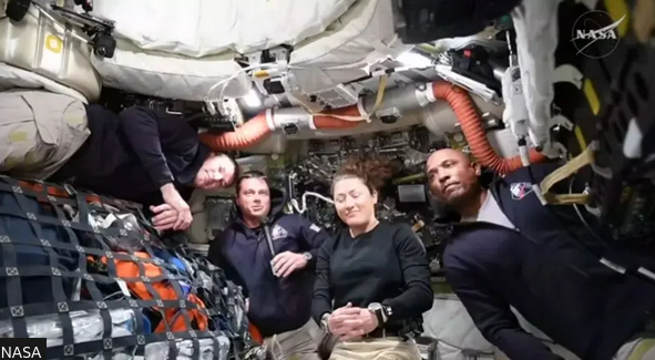 Crew speaking to earth from spacecraft