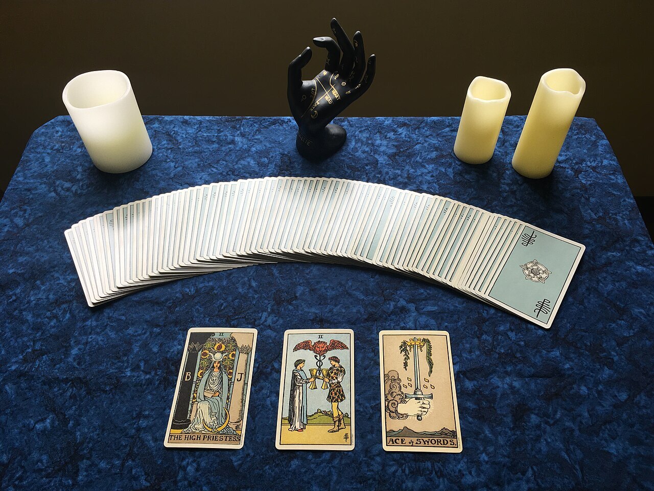 A 3-card tarot spread used for divination. The deck is the Smith-Waite Centennial Tarot Deck (a faithful reproduction of the original Rider-Waite-Smith deck from 1909)