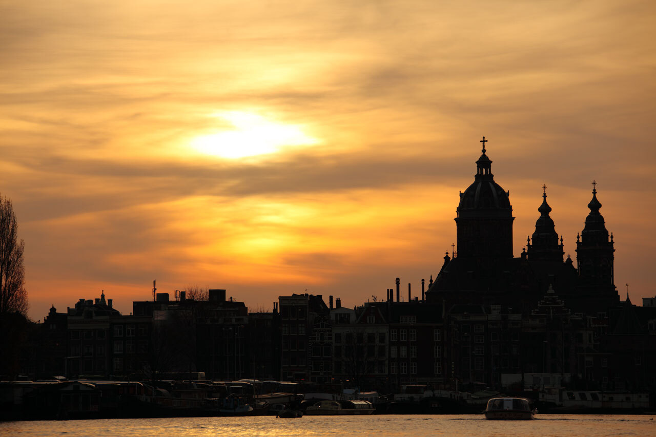 Silhouette of Amsterdam in sunset