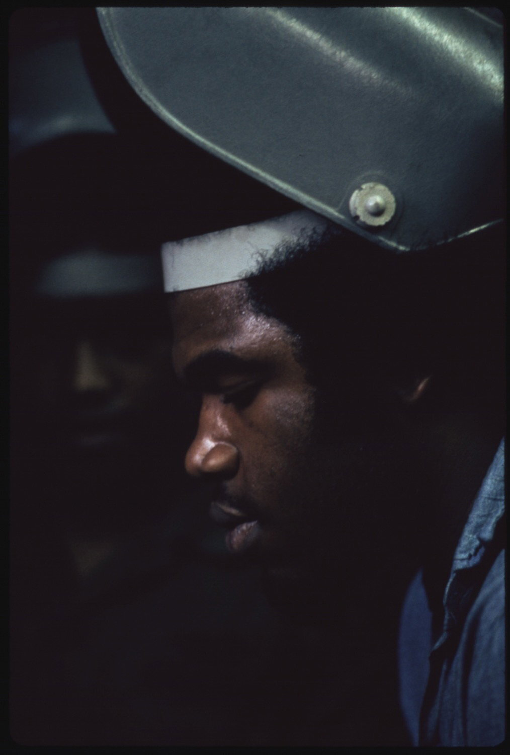 Black student welders work in a machine shop course taught at the Chicago Opportunities...