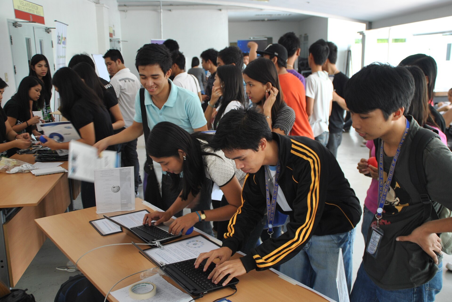 Students lined up to register at the Software Freedom Day 2011 event in the University of Santo Tomas, Manila, Philippines