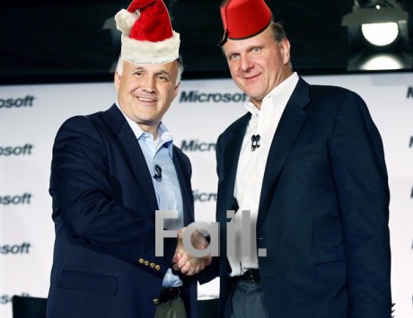 Ron Hovsepian and Steve Ballmer with red hats